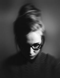 woman wearing eyeglasses in grayscale photography